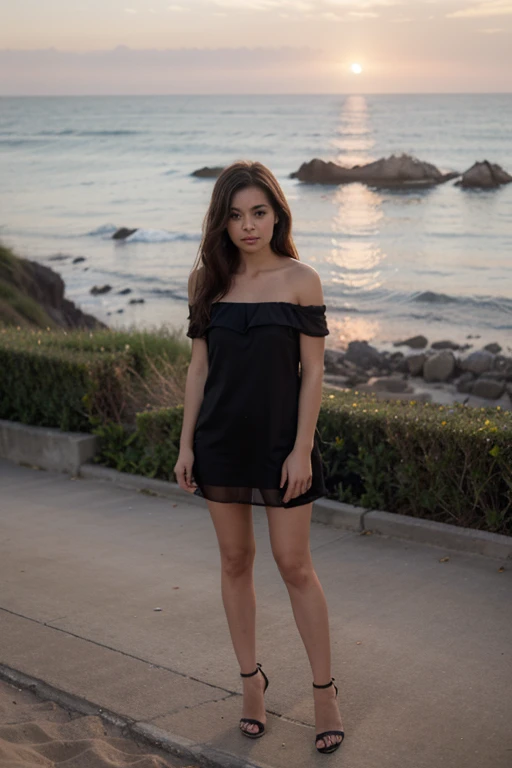 One small girl with black frock off shoulder and designer dress with heels standing near the sea during sunset