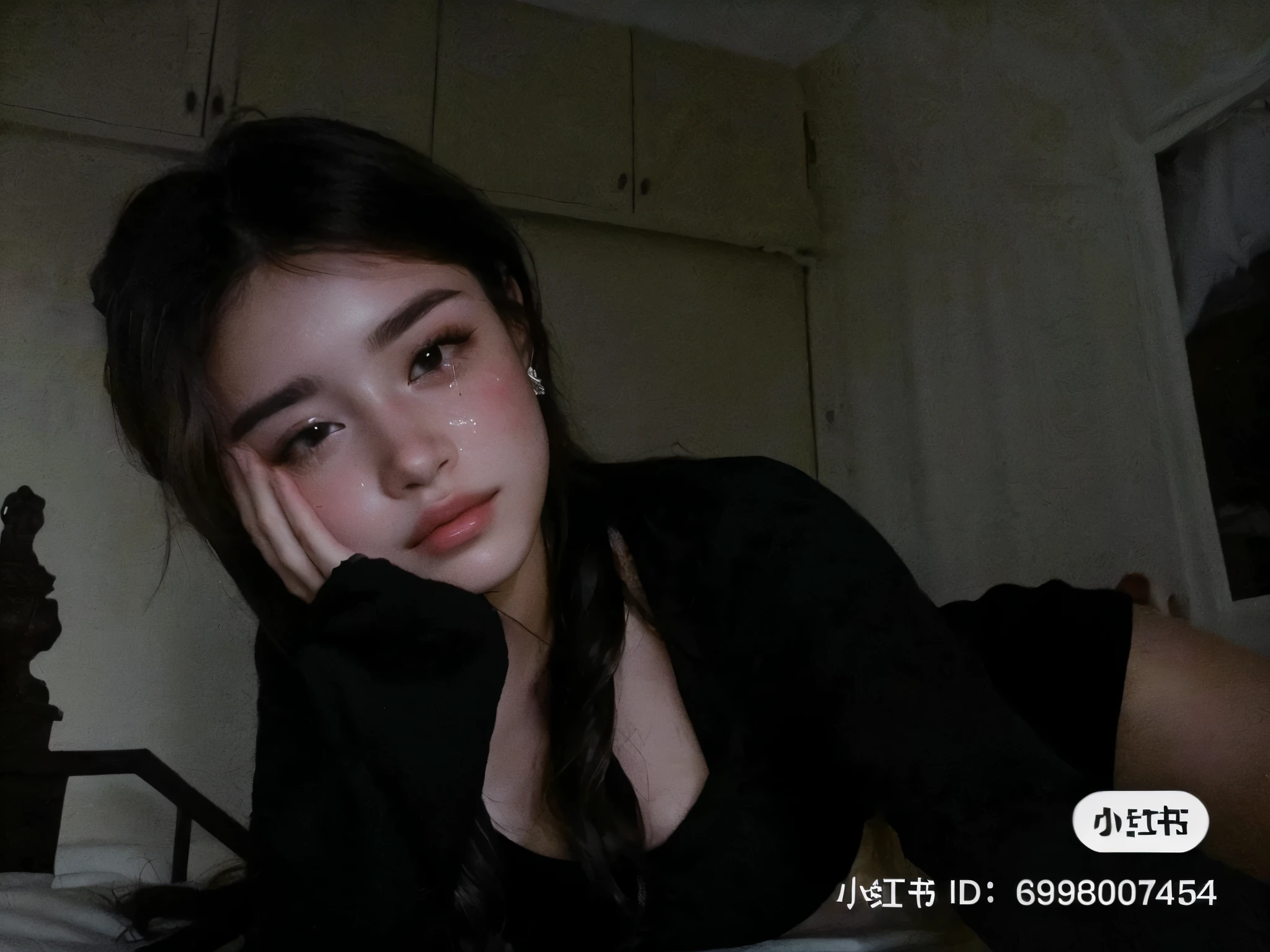 there is a woman laying on a bed with her head on her hands, 8k selfie photograph, very very low quality picture, low quality video, very very low quality, webcam screenshot, with a sad expression, very low quality, 8k)), low quality photograph, ☁🌪🌙👩🏾, giga chad crying, she has a cute face