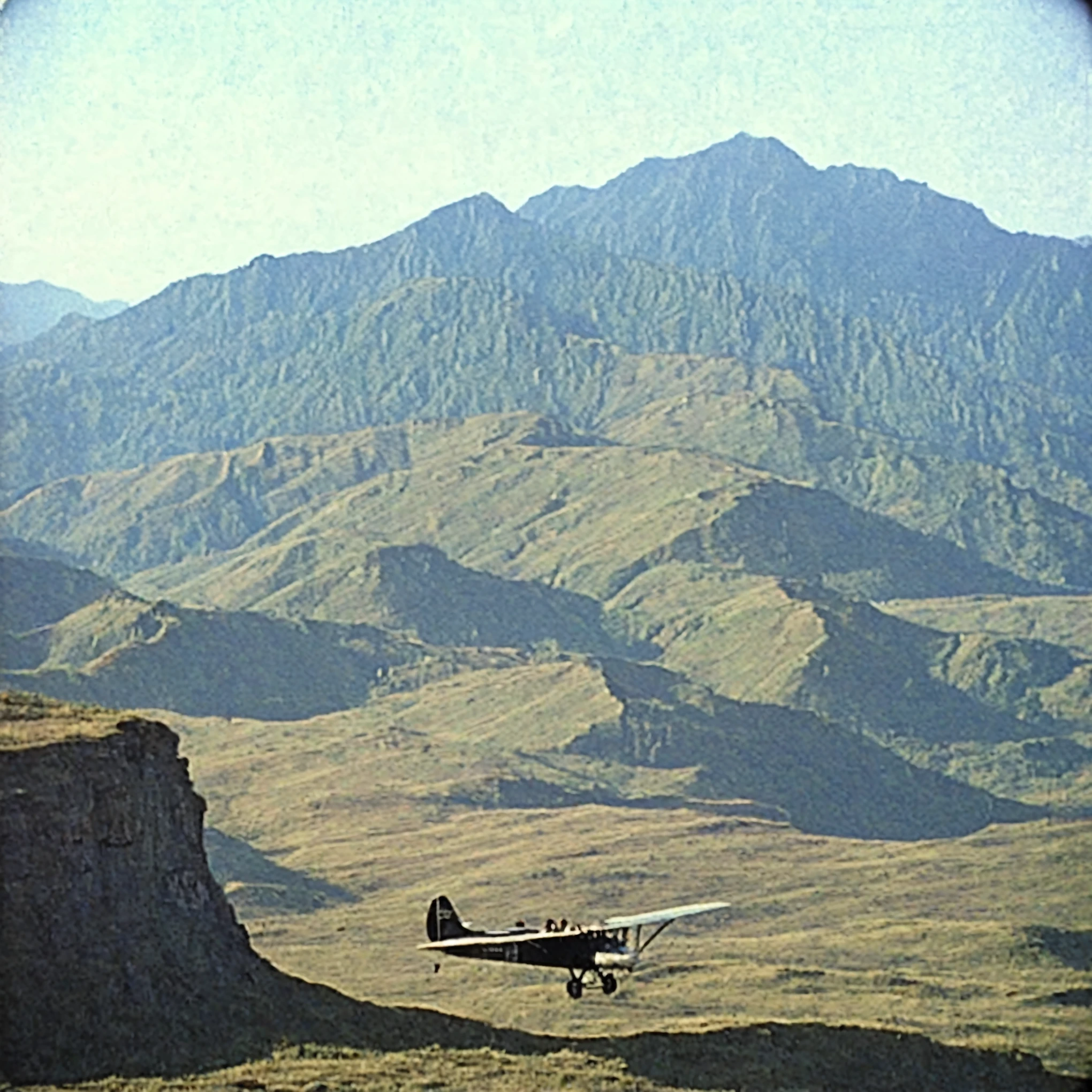 grainy old 35mm vintage, there is a group of 1900-century explorers managing airplanes and setting up acheological equipment, vast scenery