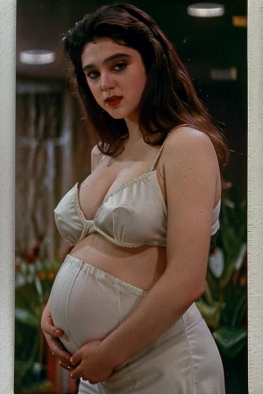 analog 35mm photo of an attractive vampire queen, 80s dark fantasy, Labyrinth 1986, Excalibur 1981, dark lighting, cinematic, pregnant belly, midriff, shoulder-cut curly hair, old vintage movie scene, grainy film, vintage film, film grain, movie still, movie screenshot, cinestill
