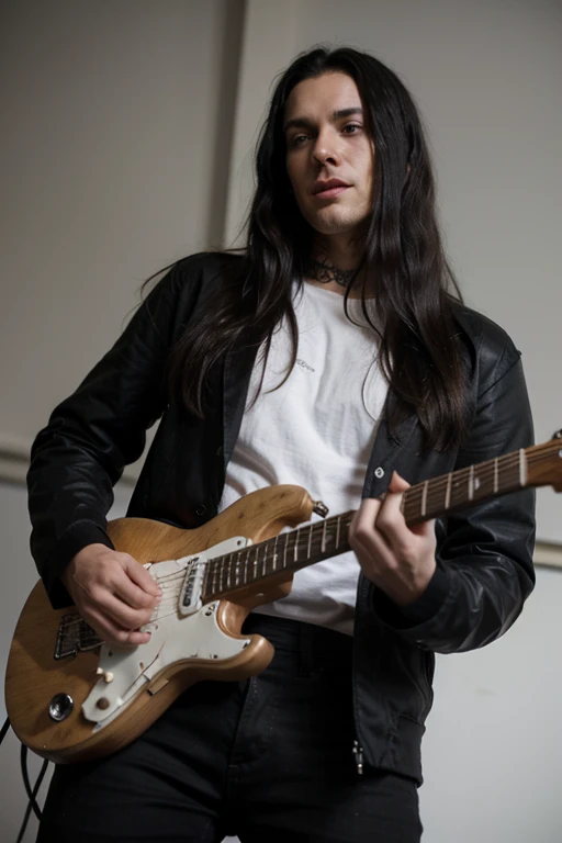 Handsome thin White man goth long black hair male playing guitar