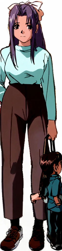 The tall and shapely Momoko Koigakubo is wearing a light blue dress and brown trousers, standing with a smile on her face and her hands clasped together.。