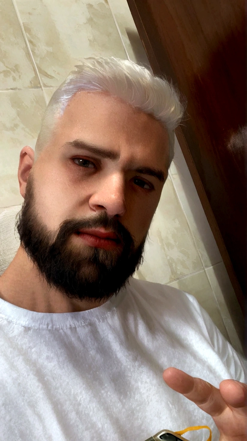 a 29 year old young man, with a black beard and white hair, can leave his bottoms off, just his white shirt