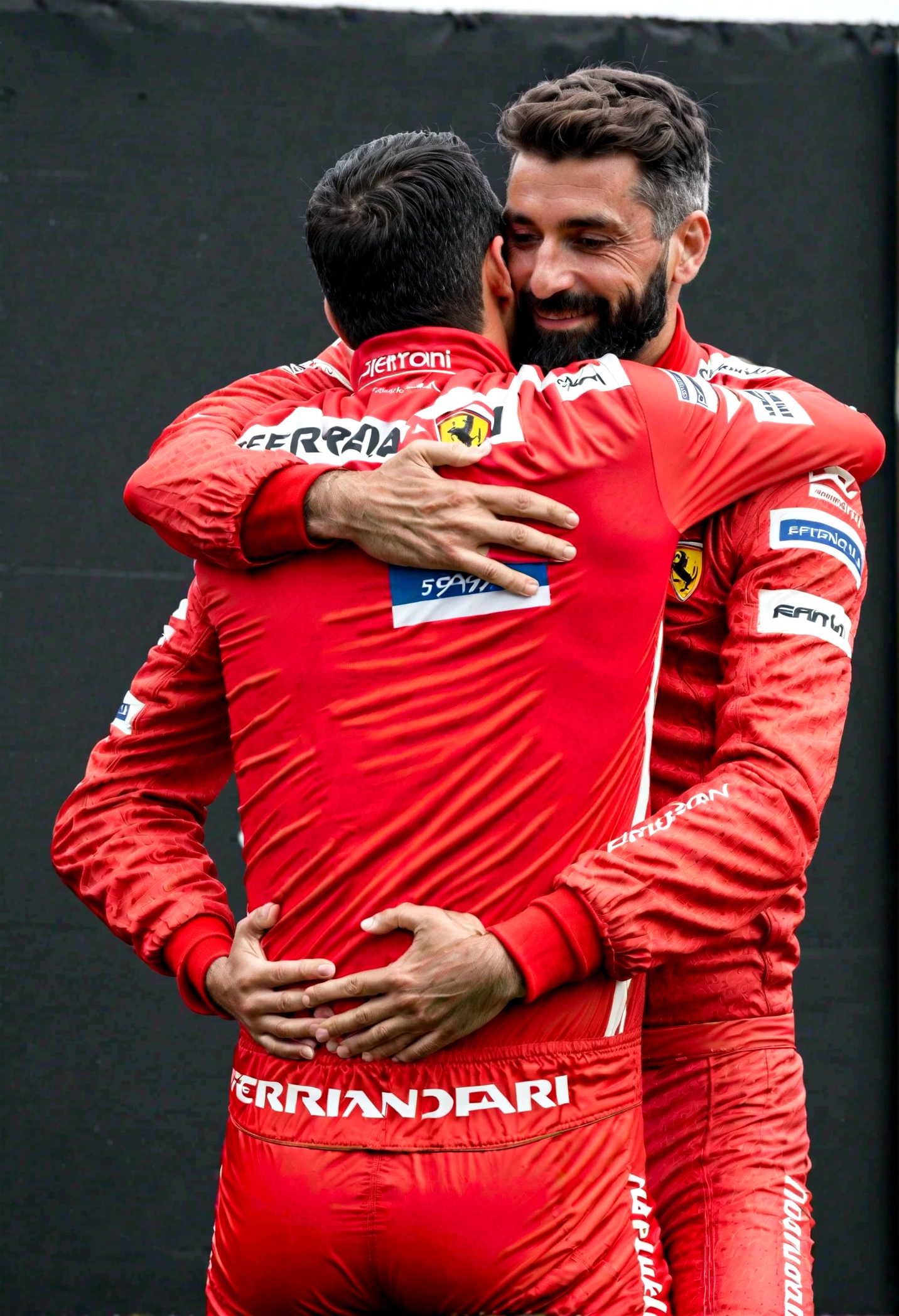 Pablo Marçal hugging Airton Sena in 1st place on the podium wearing Ferrari racing uniforms