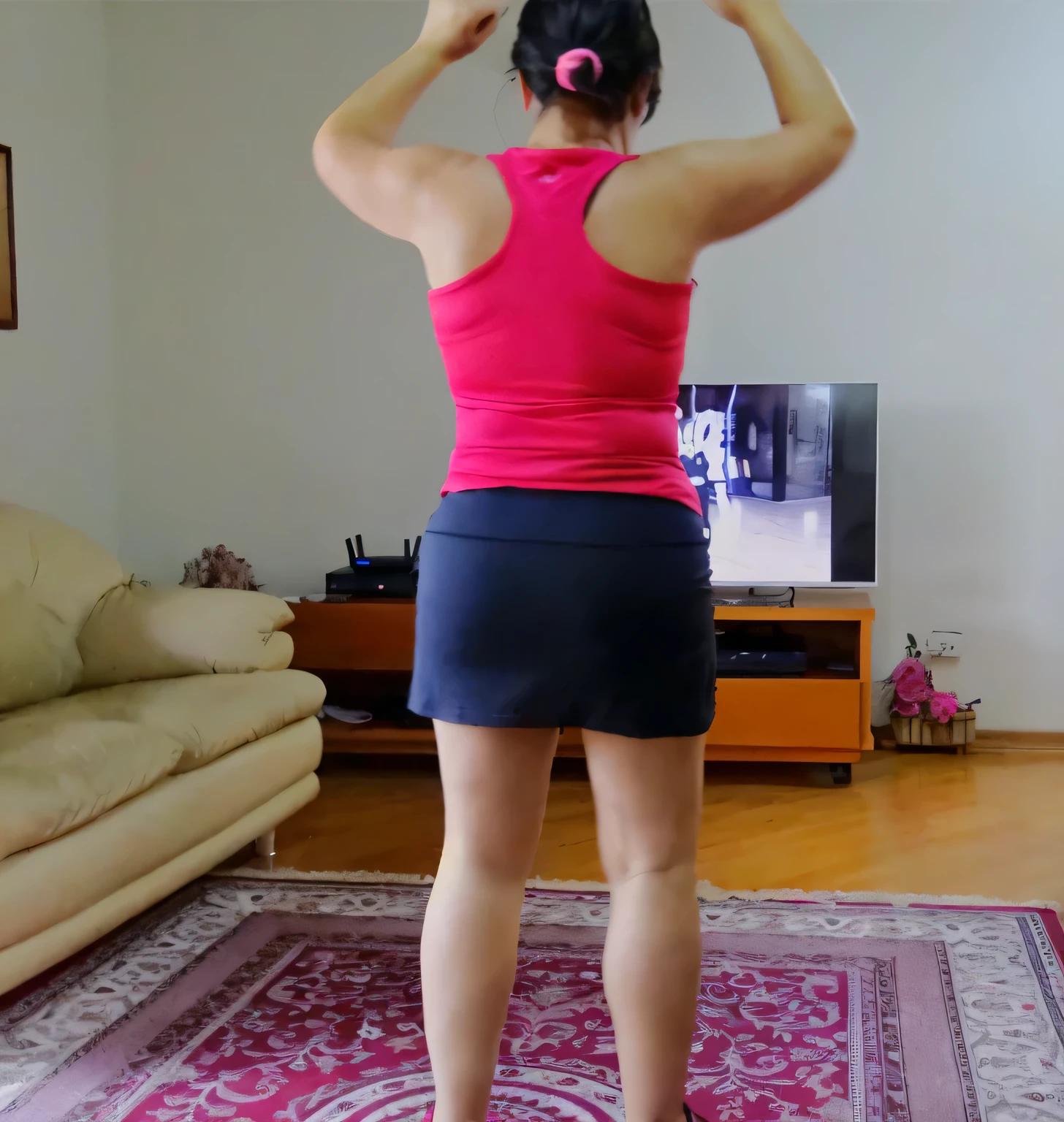 there is a woman standing in a living room playing a video game, from back, long shot from back, long shot from the back, back pose, back shot, full growth from the back, back - shot, in full growth from the back, seen from the back, shot from the back, view from the back, back view!!, from the back