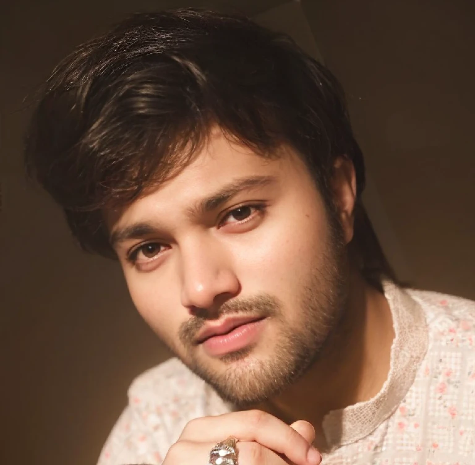 A beautiful young bearded man with highly detailed skin.