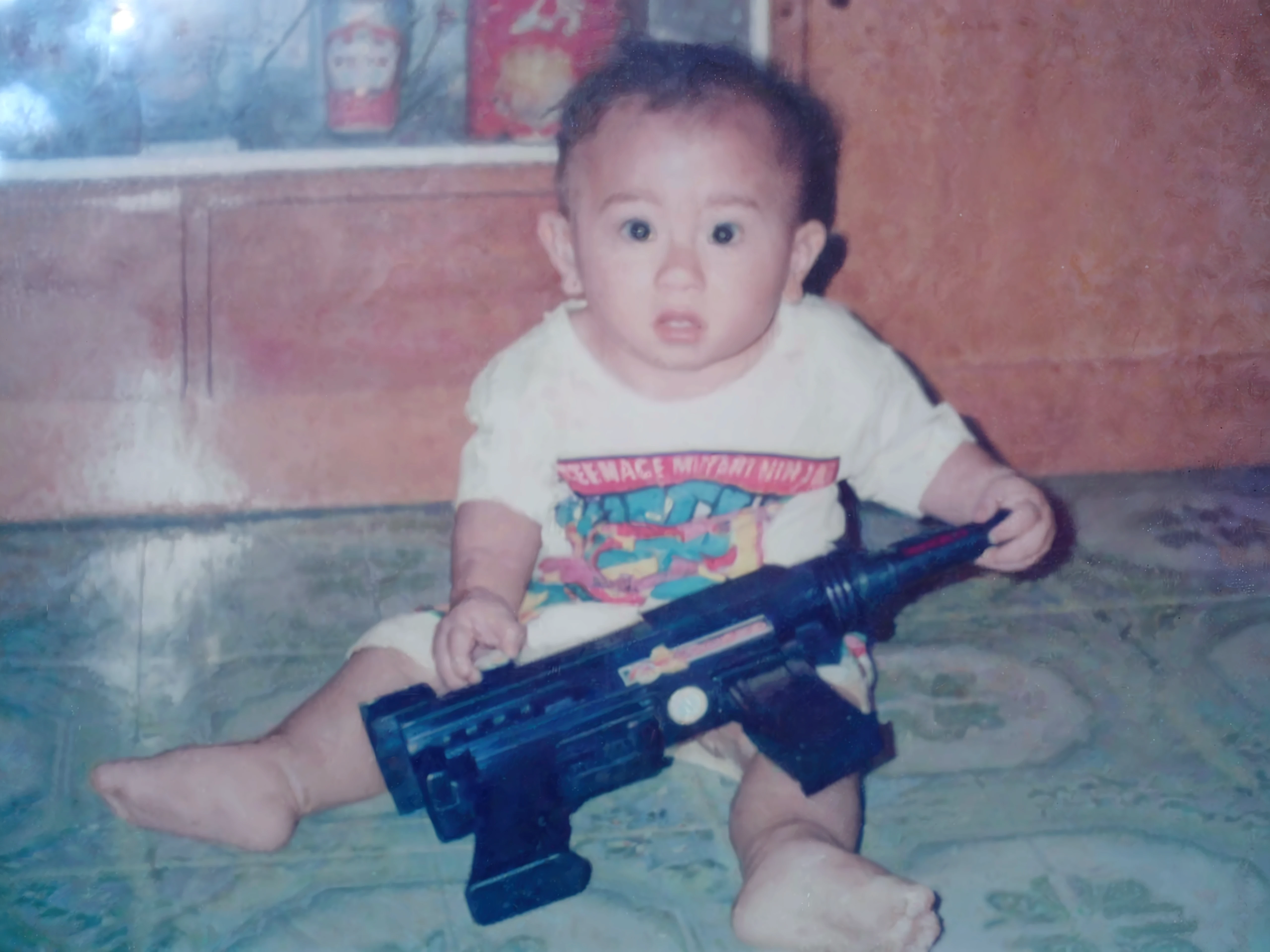 angel holding an AK-47