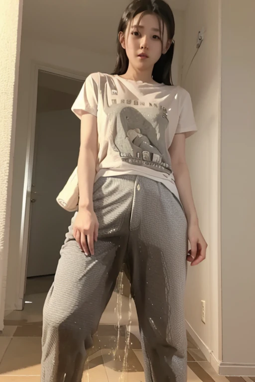 Japanese Girl wearing a white short-sleeved t-shirt sees the ghost and pees her loose gray pajama pants until his pants are wet pants in fright.