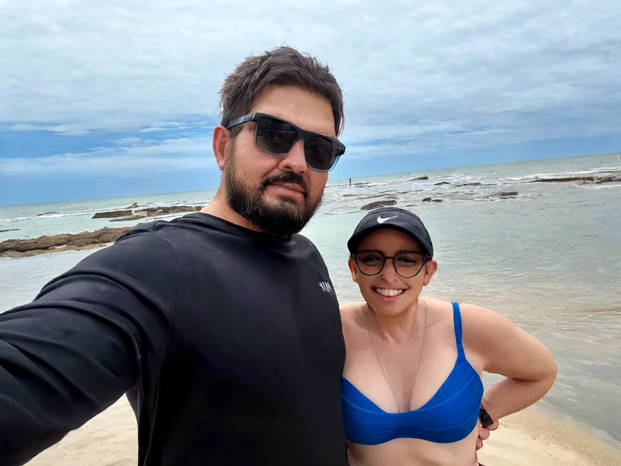 the man takes a selfie with the woman, they are both happy and happy