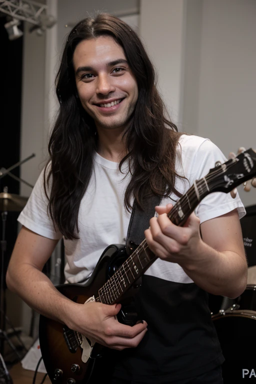 Handsome thin White man goth long black hair smiling happy guitar