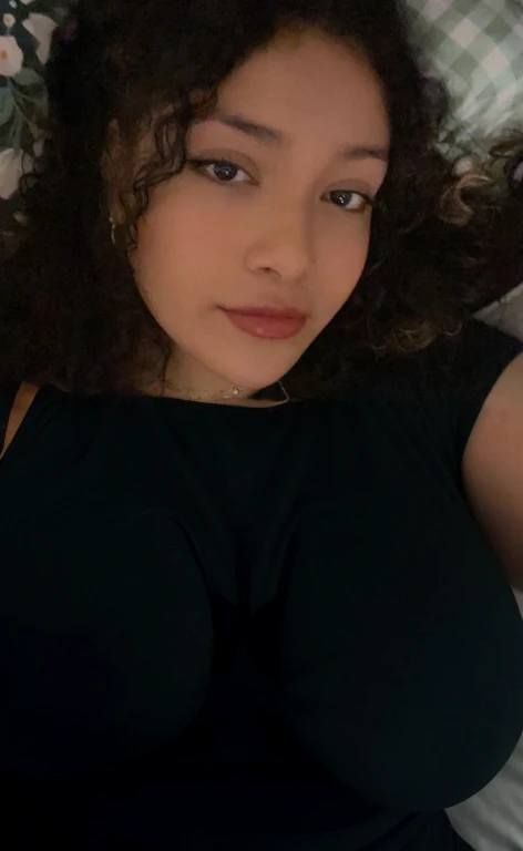 there is a woman laying in bed with a cell phone, taken in the early 2020s, profile image, around 1 , selfie of a young woman, 18 years old, alanis guillen, headshot profile picture, profile pic, 30 years old woman, 3 0 years old woman, her face framed with curls, Big tits, huge tits, no clothes, sexy, cute, minimal clothes, thick, bbw, chubby stomach, thick nipples, nipple piercings, large areola, hard nipples, piercing through shirt, nipples hard through shirt, busty, major cleavage, naked, ripping through top, spilling over sides, bra too tight, giant tits, extra wide hips, upper body zoom in, showing off huge , fat stomach, see through top, fat bbw, large areola showing, major cleavage, latina, down to stomach, wide hips, sexy, upper body zoom, thick arm, showing off , top half only, showing only upper, only a bra