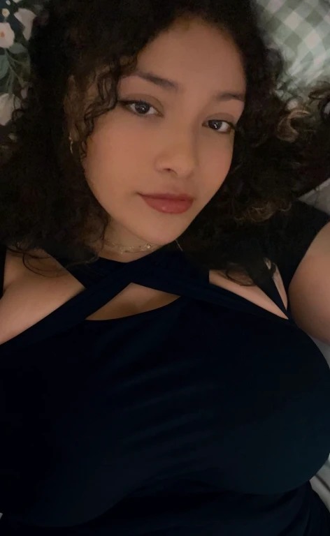 there is a woman laying in bed with a cell phone, taken in the early 2020s, profile image, around 1 , selfie of a young woman, 18 years old, alanis guillen, headshot profile picture, profile pic, 30 years old woman, 3 0 years old woman, her face framed with curls, Big tits, huge tits, no clothes, sexy, cute, minimal clothes, thick, bbw, chubby stomach, thick nipples, nipple piercings, large areola, hard nipples, piercing through shirt, nipples hard through shirt, busty, major cleavage, naked, ripping through top, spilling over sides, bra too tight, giant tits, extra wide hips, upper body zoom in, showing off huge , fat stomach, see through top, fat bbw, large areola showing, major cleavage, latina, down to stomach, wide hips, sexy, upper body zoom, thick arm, showing off , top half only, showing only upper, only a bra