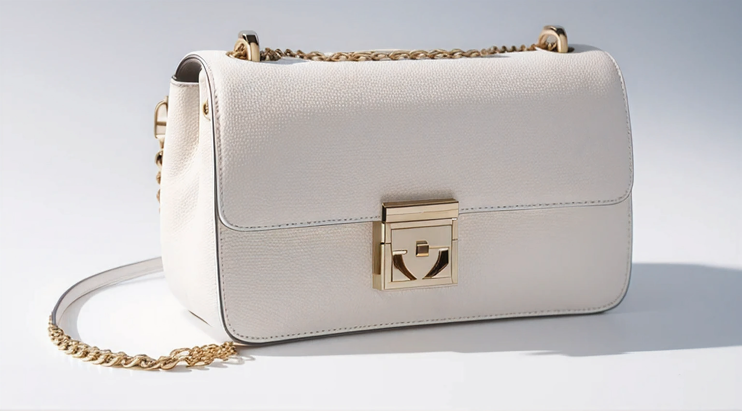 an exclusive high style luxury hand bag on the ground, wide shoot, in isolated white background, high detail, 8k