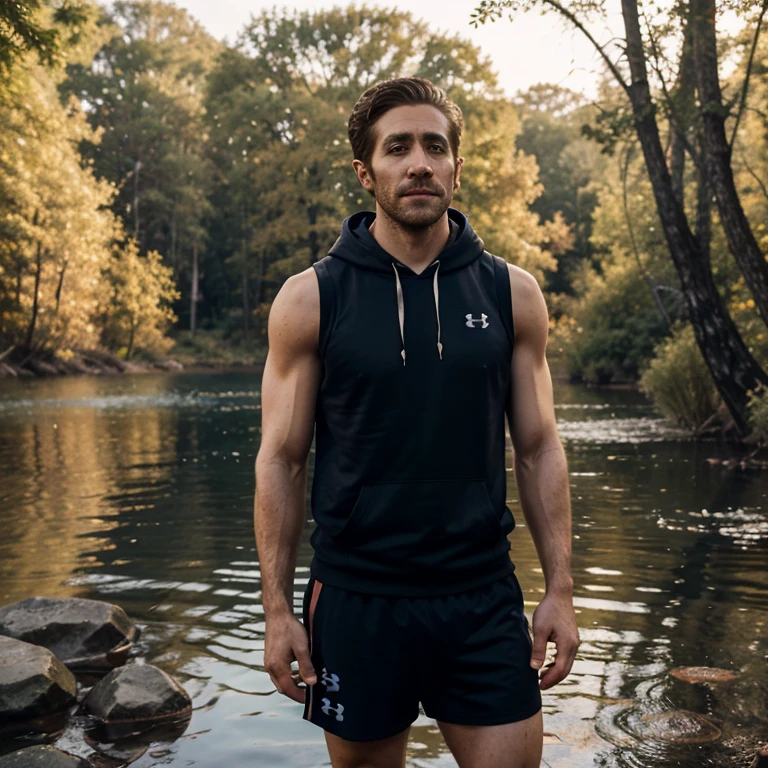 photo of jake gyllenhaal a man wearing a sleeveless well-fitted under armour hoodie and compression shorts, standing lake, fishing, outdoor trail, 35mm photograph, film, bokeh, professional, 4k, highly detailed, creek in the background, natural lighting, golden hour
