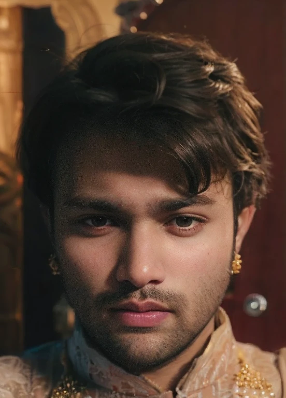 A beautiful young bearded man with highly detailed skin.