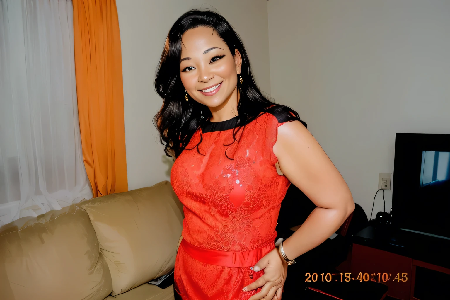 smiling woman in red dress standing in front of a couch in a living room, 40 years old women, (38 years old), she is about 40 years old, she is about 40 years old, she is about 40 years old, she is about 42 years old, about 42 years old