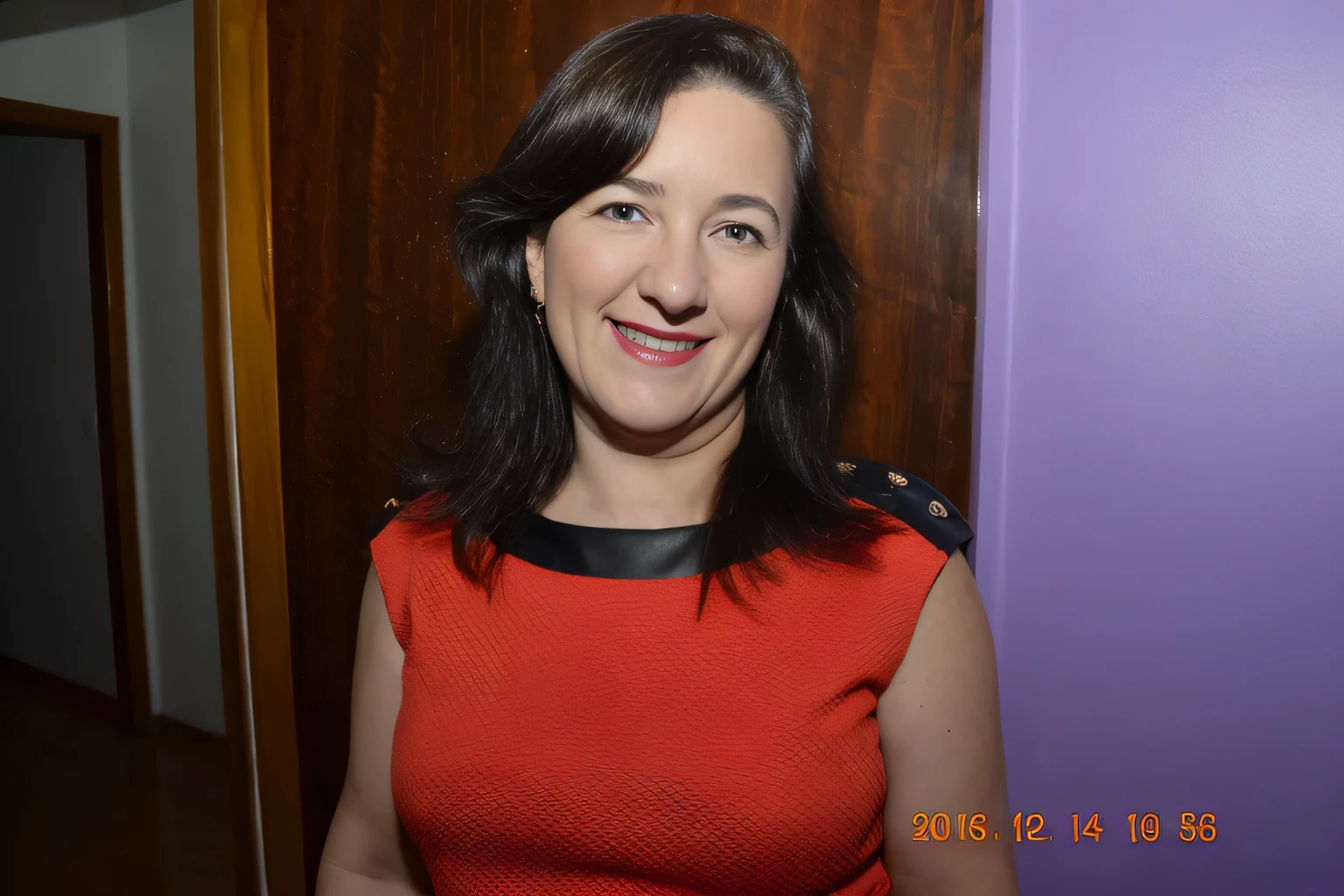 smiling woman in red dress standing in front of a purple wall, sandra chevier, by Amelia Peláez, 40 years old women, by Verónica Ruiz de Velasco, ana de la reguera portrait, by Nándor Katona, photo of sheryl sandberg, dawn mcteigue, diane ramic, mina petrovic