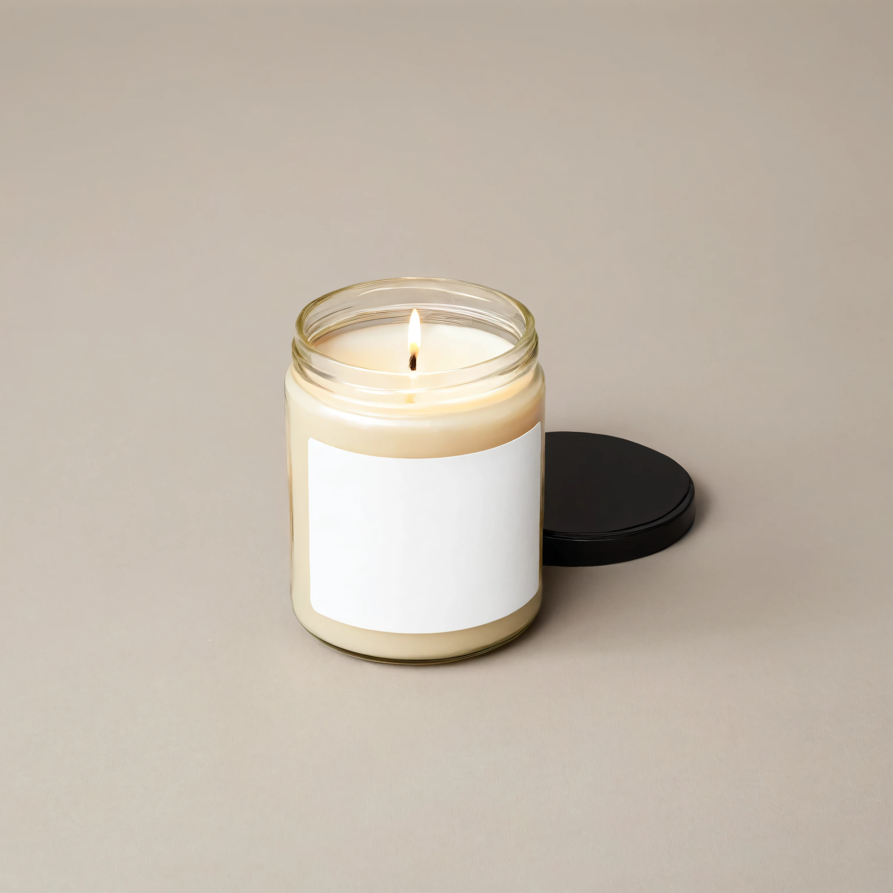 Mockup empty, a blank small beige candle in a jar with white label and black lid on white background