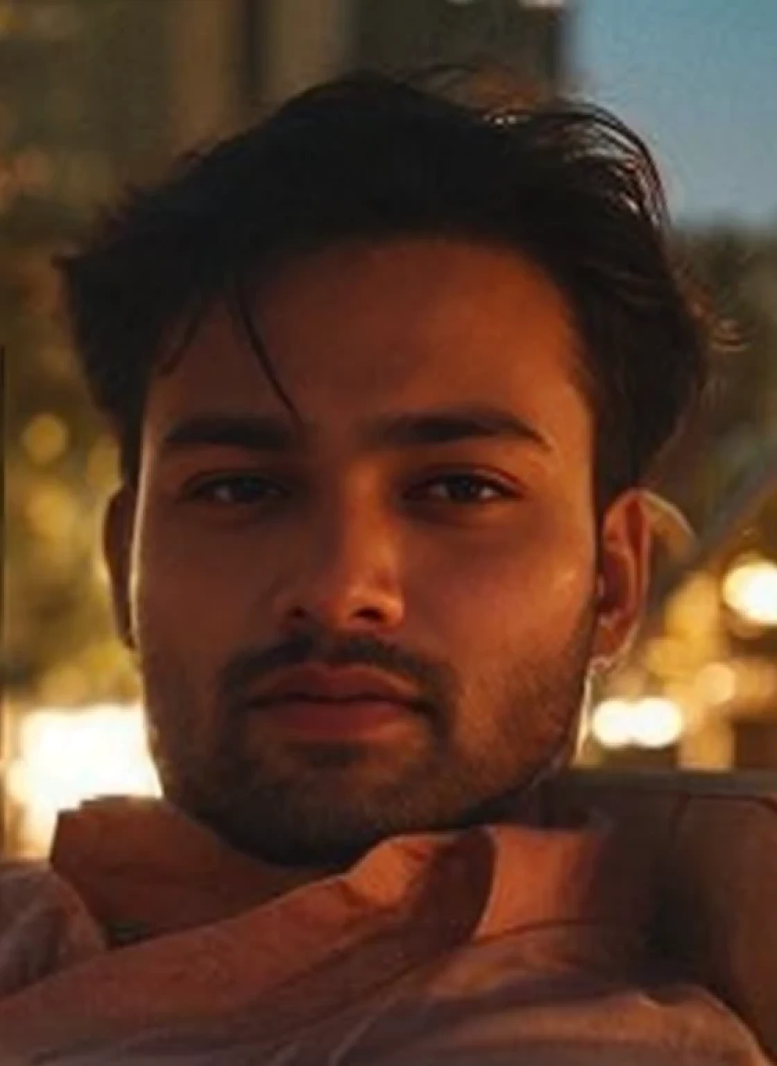A beautiful young bearded man with highly detailed skin.