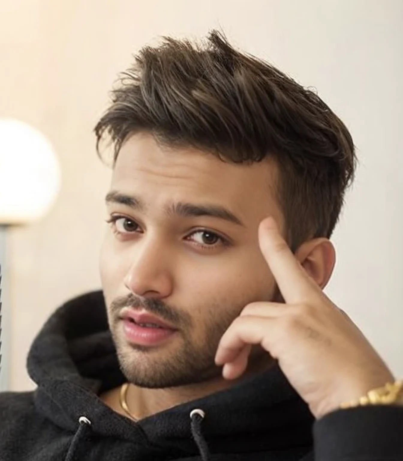 A beautiful young bearded man with highly detailed skin.