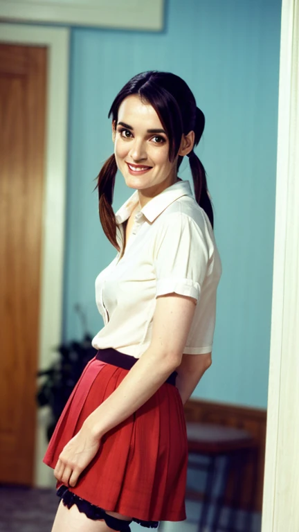 Winona Ryder with her hair in pigtails dressed in a shirt and short skirt with stockings and a sexy smile