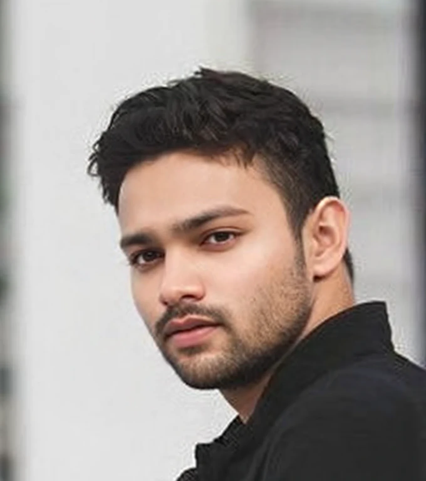 A beautiful young bearded man with highly detailed skin.