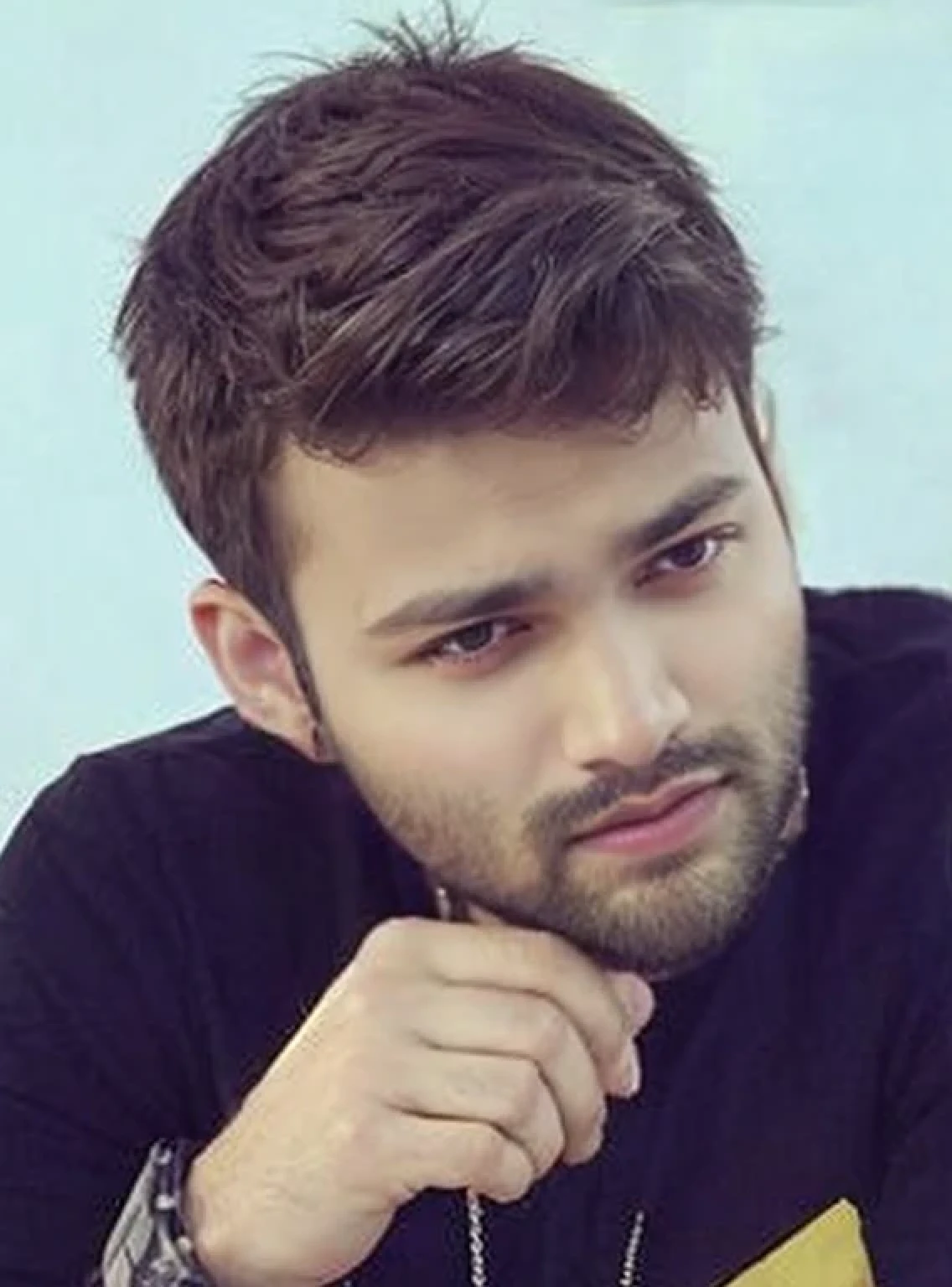 A beautiful young bearded man with highly detailed skin.