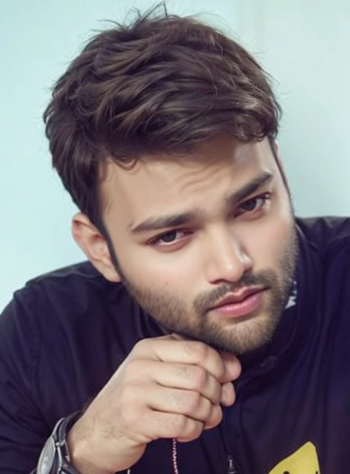 A beautiful young bearded man with highly detailed skin.