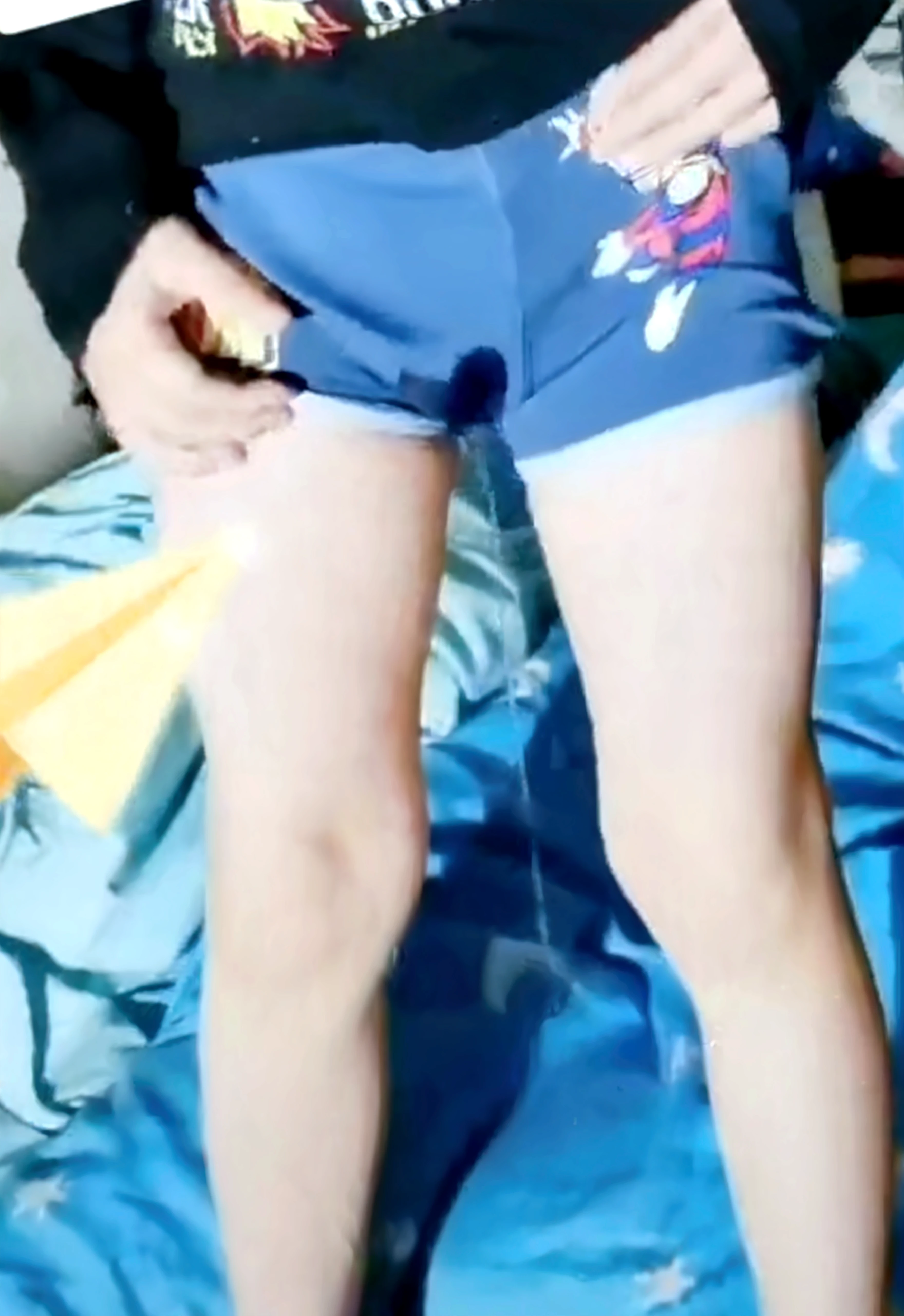 Realistic photo of Nick Robinson,  a young man, twink, wearing a diaper , lying in bed,