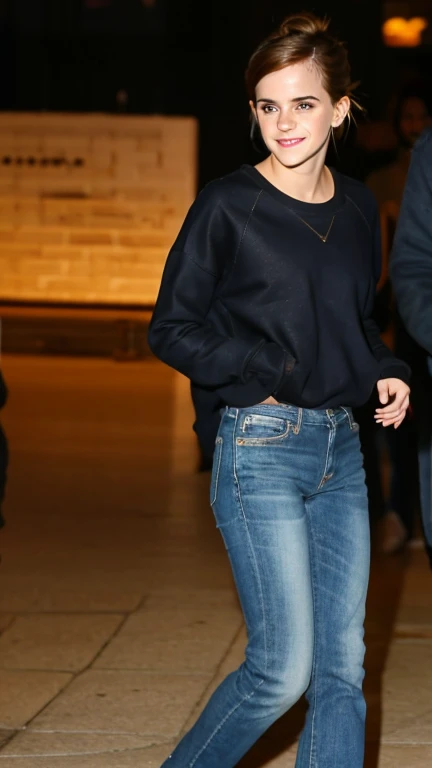 Emma Watson dressed in a sweatshirt and jeans and a sexy smile.