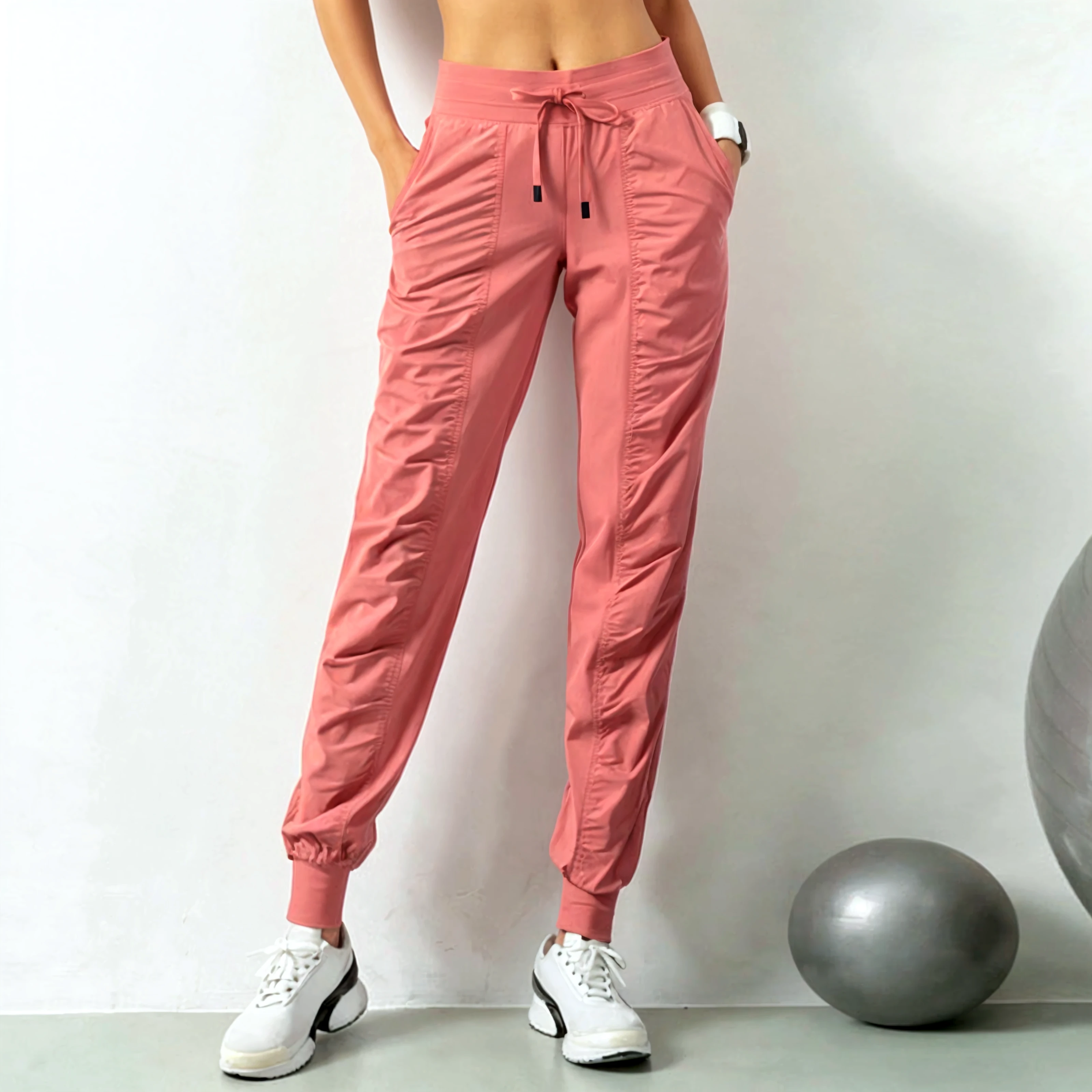 Create a dynamic advertising poster for women's gym pants. Showcase a Malay girl in hijab confidently engaged in various sports activities. Capture the energy and versatility of the gym pants in action. in Wes Anderson style, hyper - realistic photography, Wes Anderson style, full body, 8k, close - up shot, extreme close - up photo