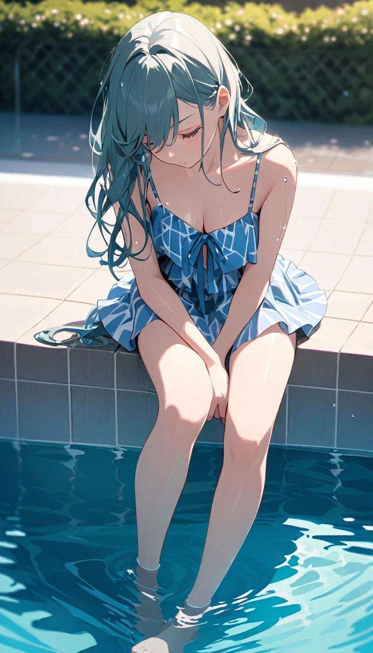 "A model sitting on the edge of a pool, feet in the water, looking down and playing with her hair."