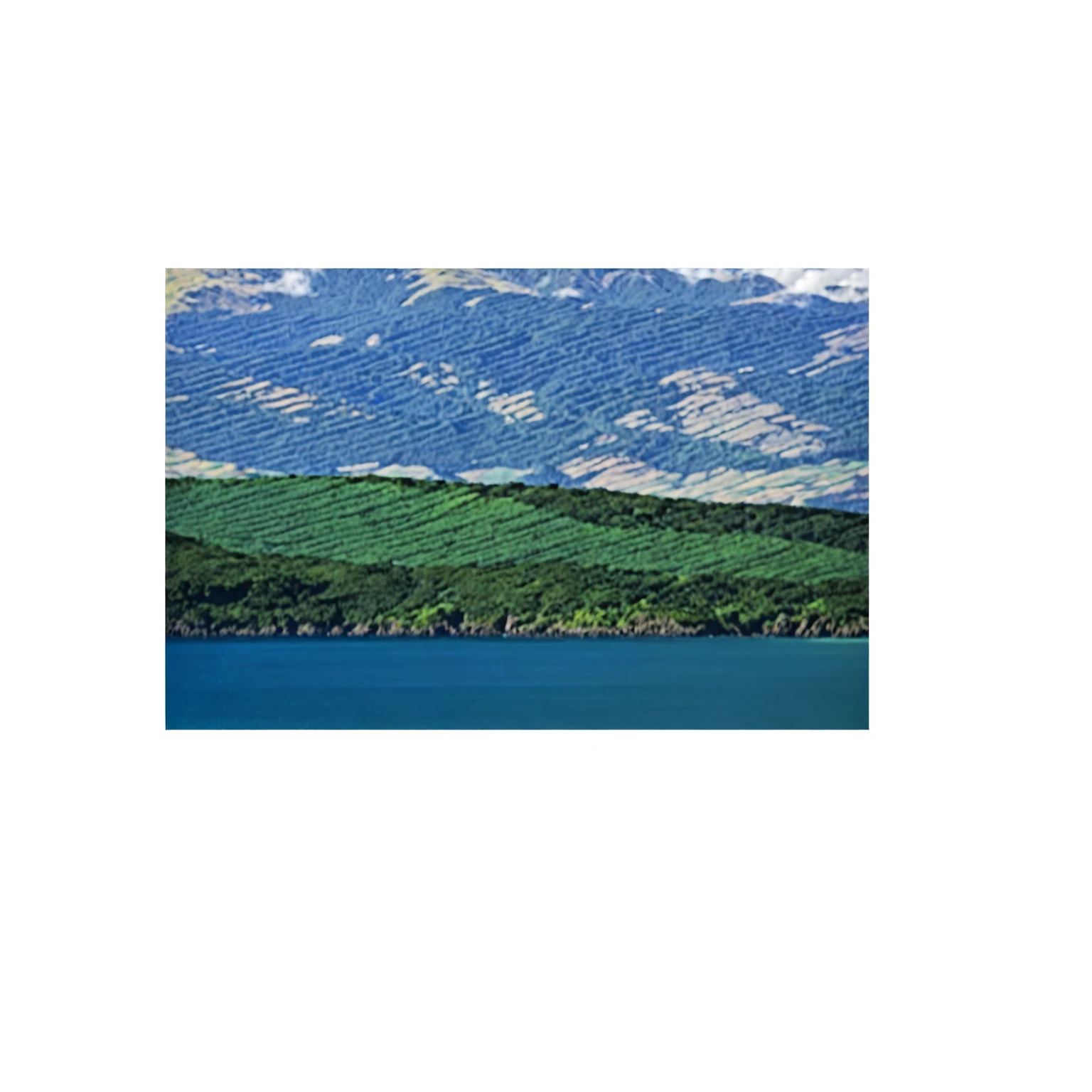 a photograph of a landscape mountain sky and ocean