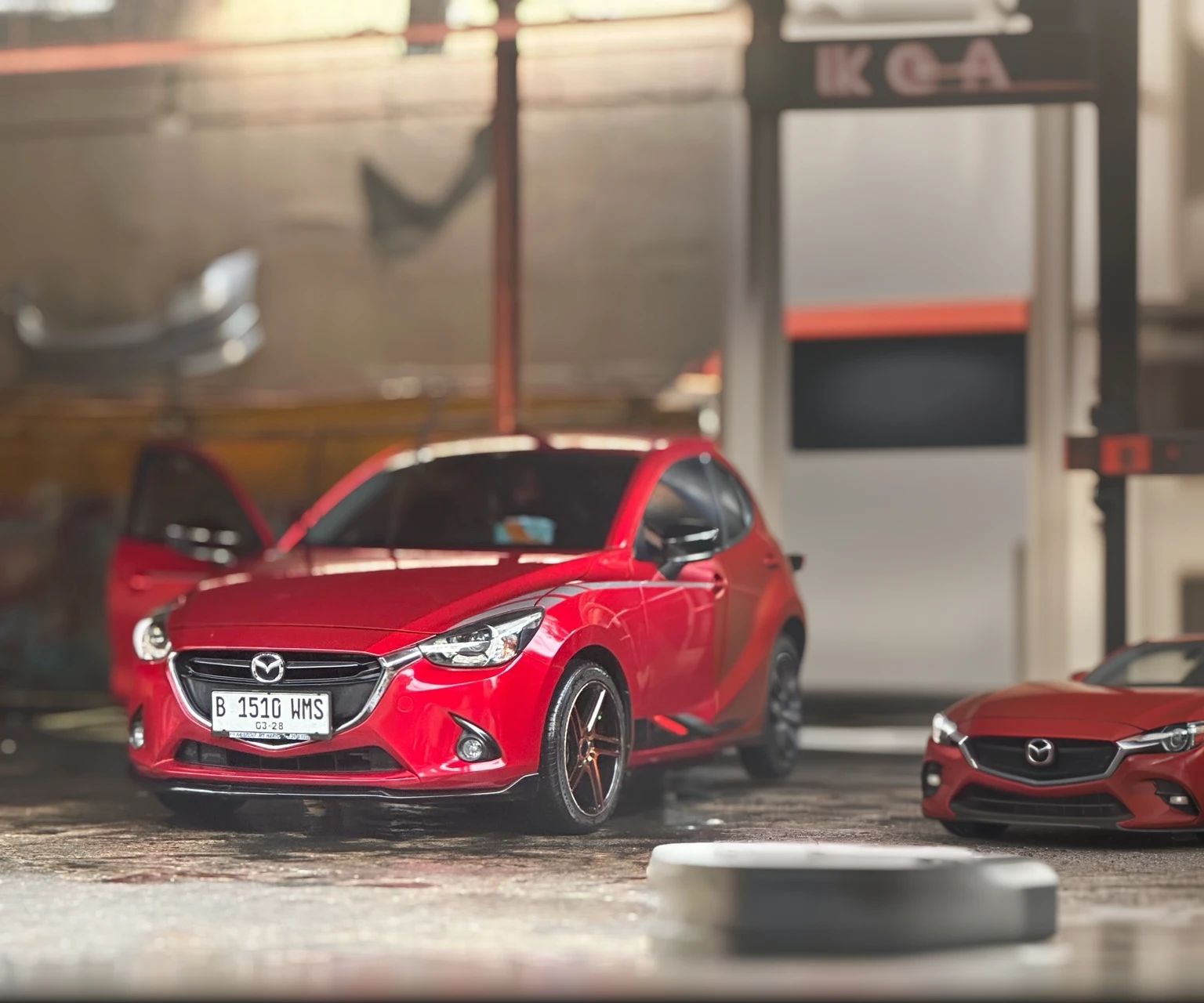 detailed red mazda 2 skyactiv car, photo-realistic, (best quality,4k,8k,highres,masterpiece:1.2),ultra-detailed,(realistic,photorealistic,photo-realistic:1.37),HDR,UHD,studio lighting,ultra-fine painting,sharp focus,physically-based rendering,extreme detail description,professional,vivid colors,bokeh,concept car,automotive,transportation