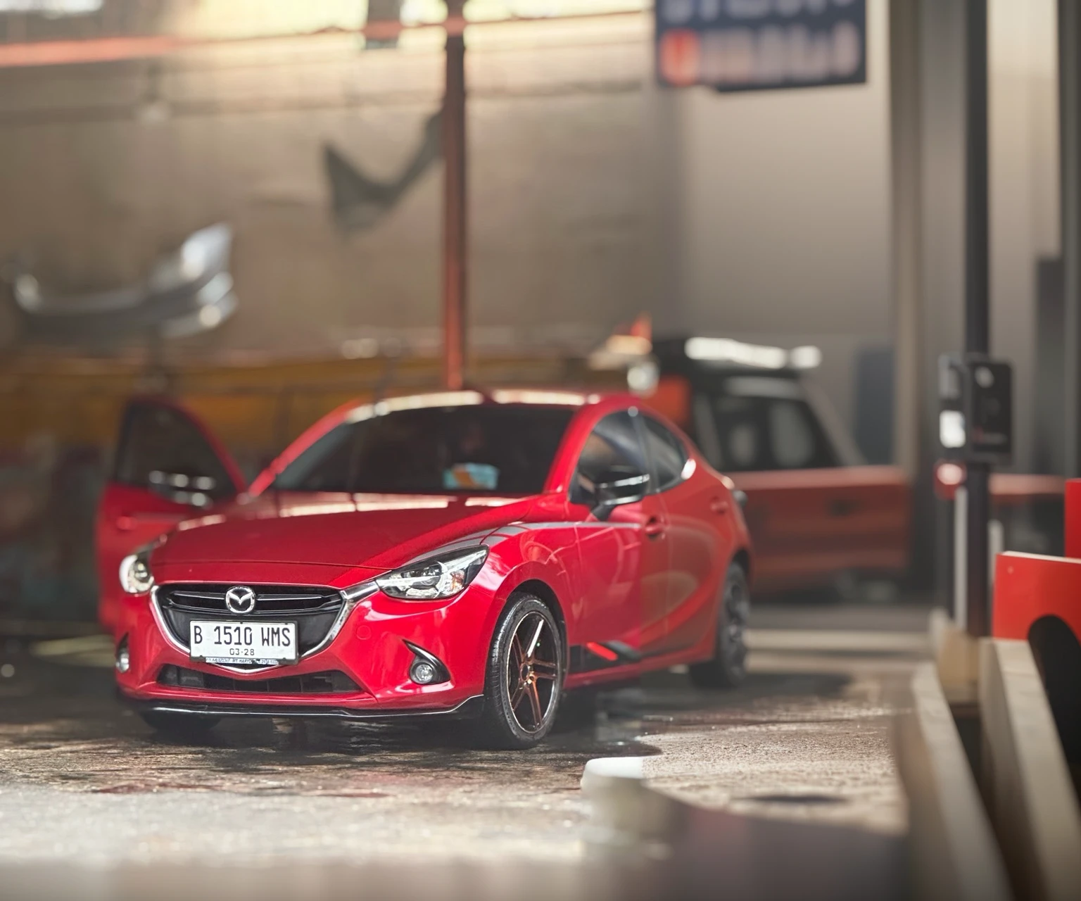 detailed red mazda 2 skyactiv car, photo-realistic, (best quality,4k,8k,highres,masterpiece:1.2),ultra-detailed,(realistic,photorealistic,photo-realistic:1.37),HDR,UHD,studio lighting,ultra-fine painting,sharp focus,physically-based rendering,extreme detail description,professional,vivid colors,bokeh,concept car,automotive,transportation