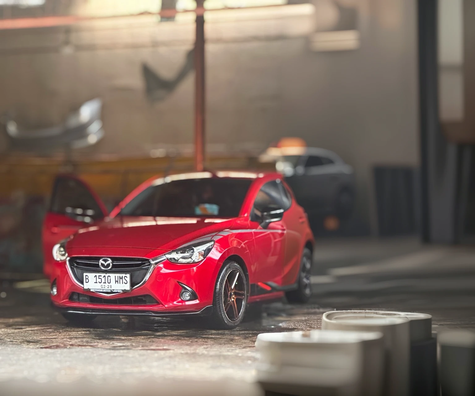 detailed red mazda 2 skyactiv car, photo-realistic, (best quality,4k,8k,highres,masterpiece:1.2),ultra-detailed,(realistic,photorealistic,photo-realistic:1.37),HDR,UHD,studio lighting,ultra-fine painting,sharp focus,physically-based rendering,extreme detail description,professional,vivid colors,bokeh,concept car,automotive,transportation