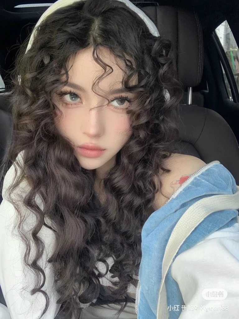 arafed woman with long curly hair sitting in a car, with long curly hair, curly bangs, white curly hair, curly middle part haircut, curly, long messy curly hair, pale skin curly blond hair, curly haired, with haunted eyes and curly hair, curly hair, with long curly, long curly hair, large eyes and flowing long hair, curly dark hair