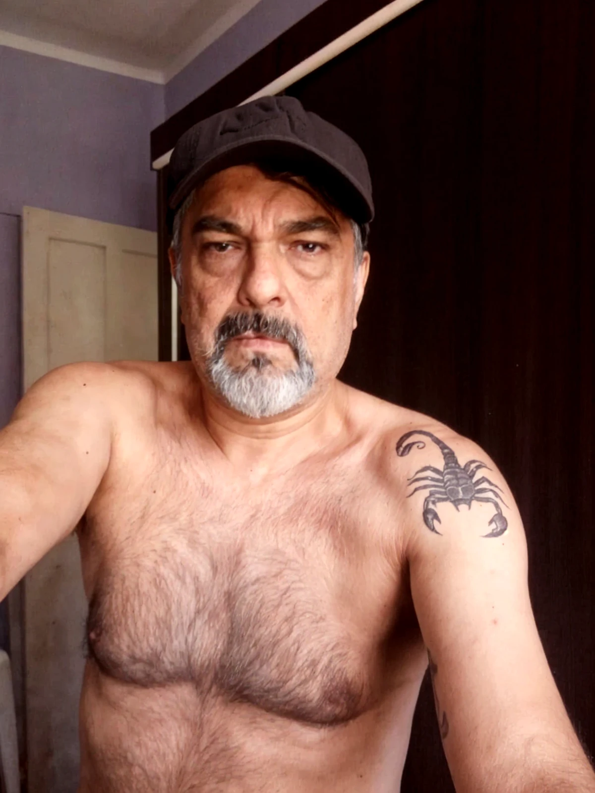 make a pumped old Latin American man with no hair and glasses with tattoos