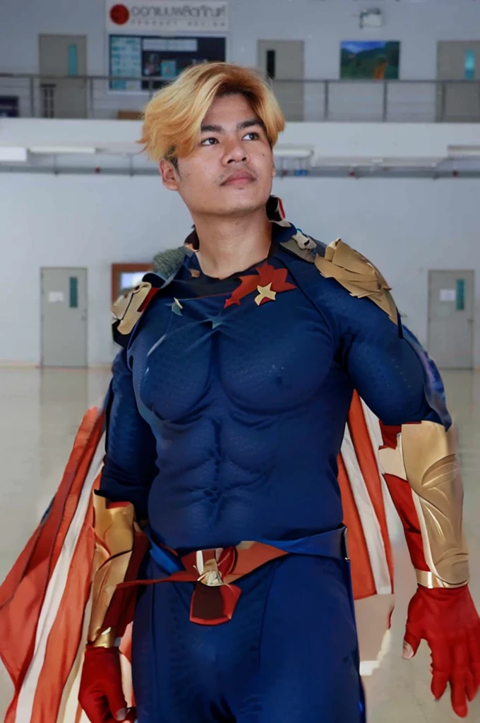 Homelander's costume heavily features American patriotic symbols, such as the stars and stripes, which underline his public persona as a hero embodying American values.
Color Scheme: The red, white, and blue color scheme is prominent, enhancing his image as the quintessential American superhero.
Armor-like Elements: His suit is designed to look almost like armor, suggesting strength and invulnerability, reflecting his superhuman abilities.
Cape and Eagle Motif: He sports a cape, often associated with traditional superheroes, and an eagle emblem on his shoulder, further reinforcing the American theme.
