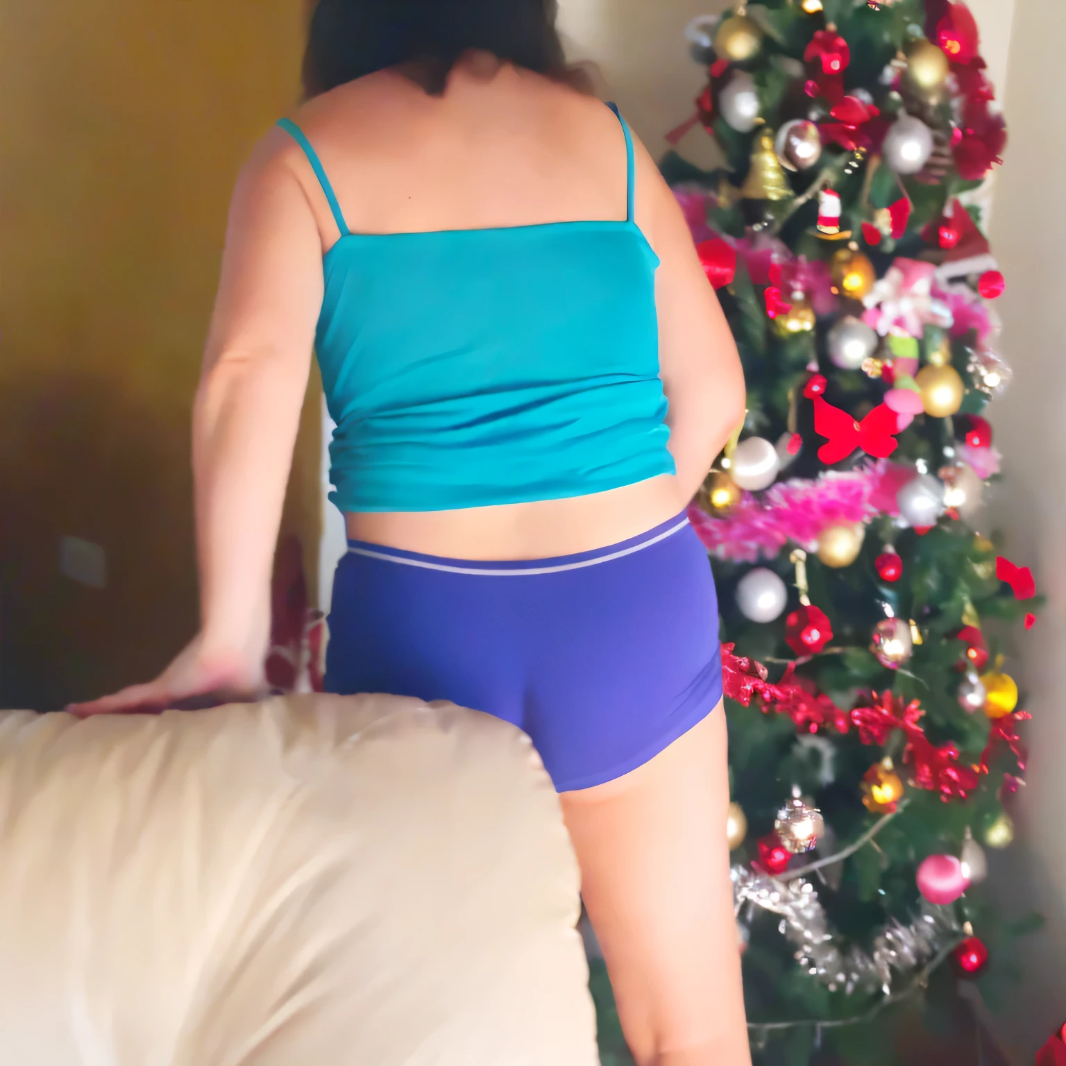araffe woman in blue underwear standing next to a christmas tree, view from the back, seen from the back, shot from the back, with a tree in the background, waist - shot, photographed from the back, bright blue shiny lingerie, from the back, view from back, photo taken from behind, long shot from the back, tree in the background