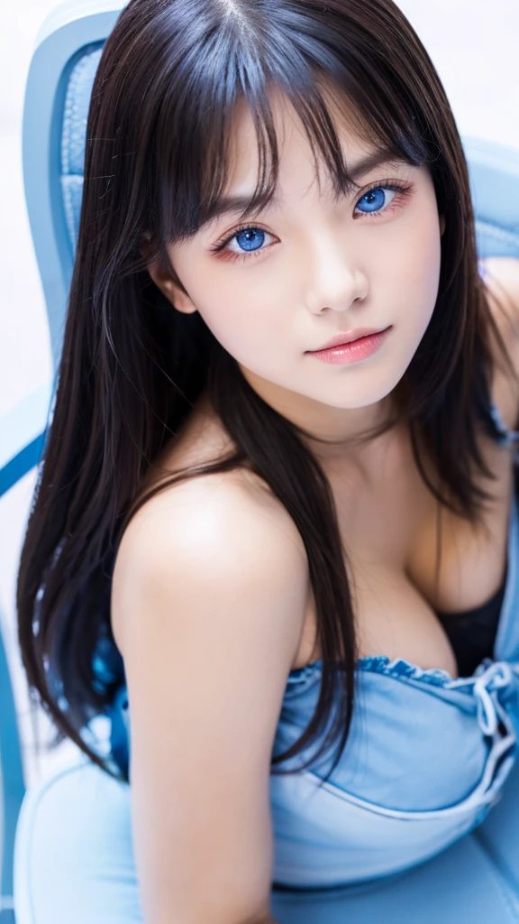 Her left eyes is blue, she is sitting on a chair.