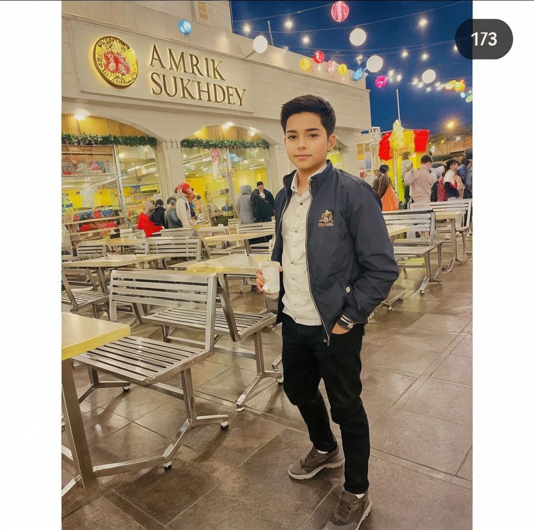 Add a girls standing beside of this boy in image