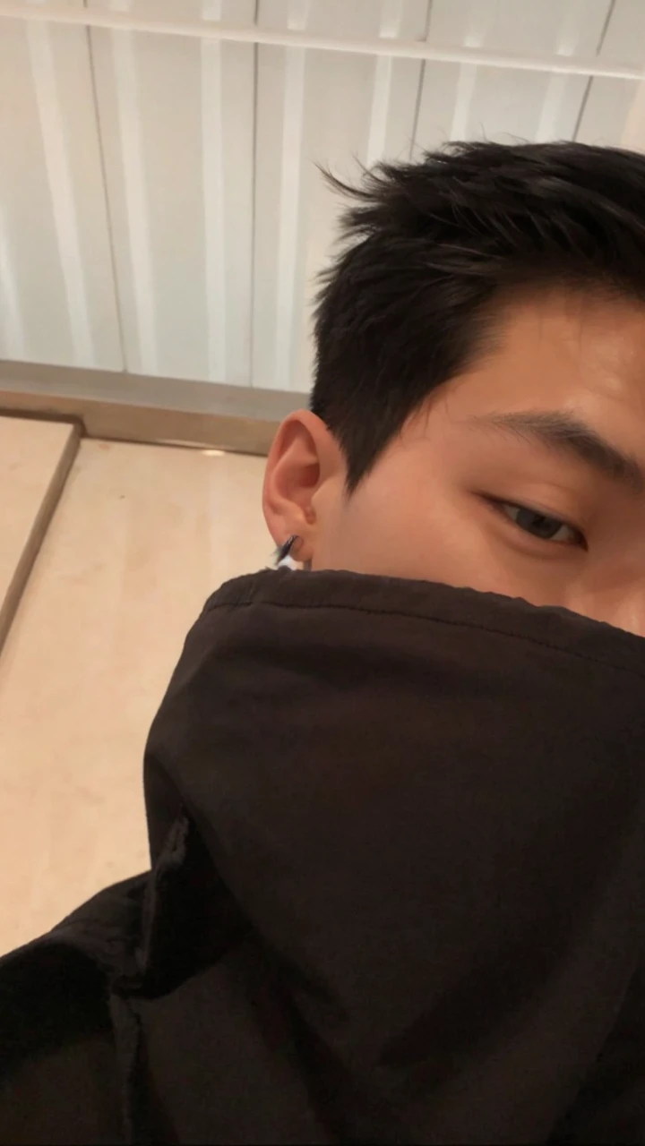 an Asian boy with his face in half