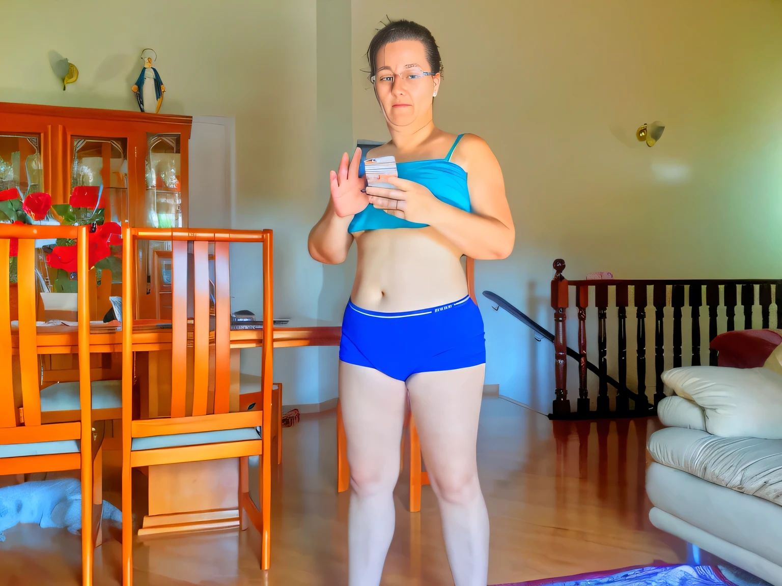 there is a woman in a blue bikini and blue panties taking a selfie, sport bra and dark blue shorts, physical : tinyest midriff ever, sport bra and shorts, 3 6 years old, skinny waist and thick hips, full body wide shot, her belly button is exposed, belly exposed, half body cropping, middle shot waist up