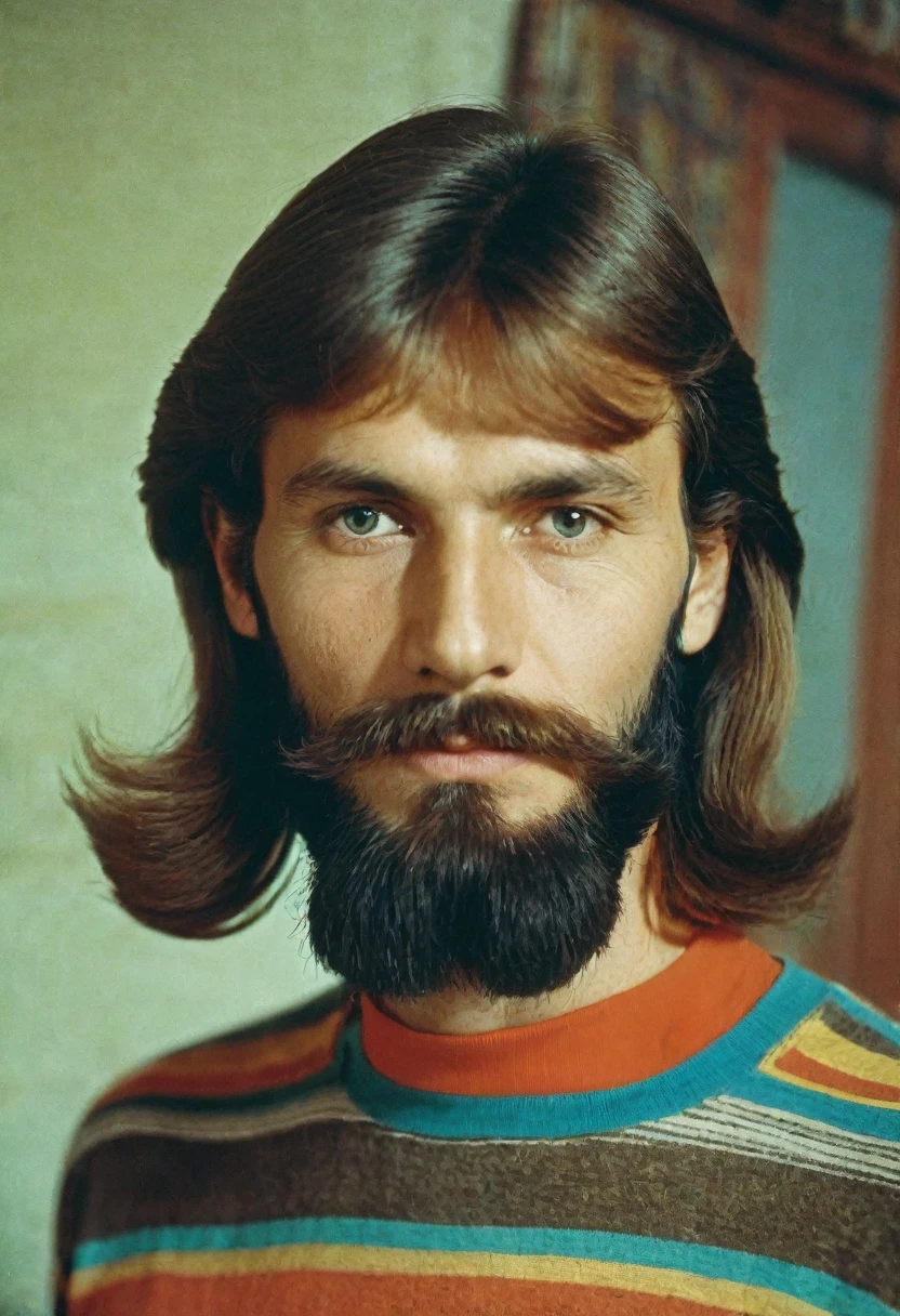 color photo, kind man, portrait photo, in 1980 style, USSR, photo taken in the apartment. The man has good facial features and a long beard., long hair, wearing a colorful T-shirt