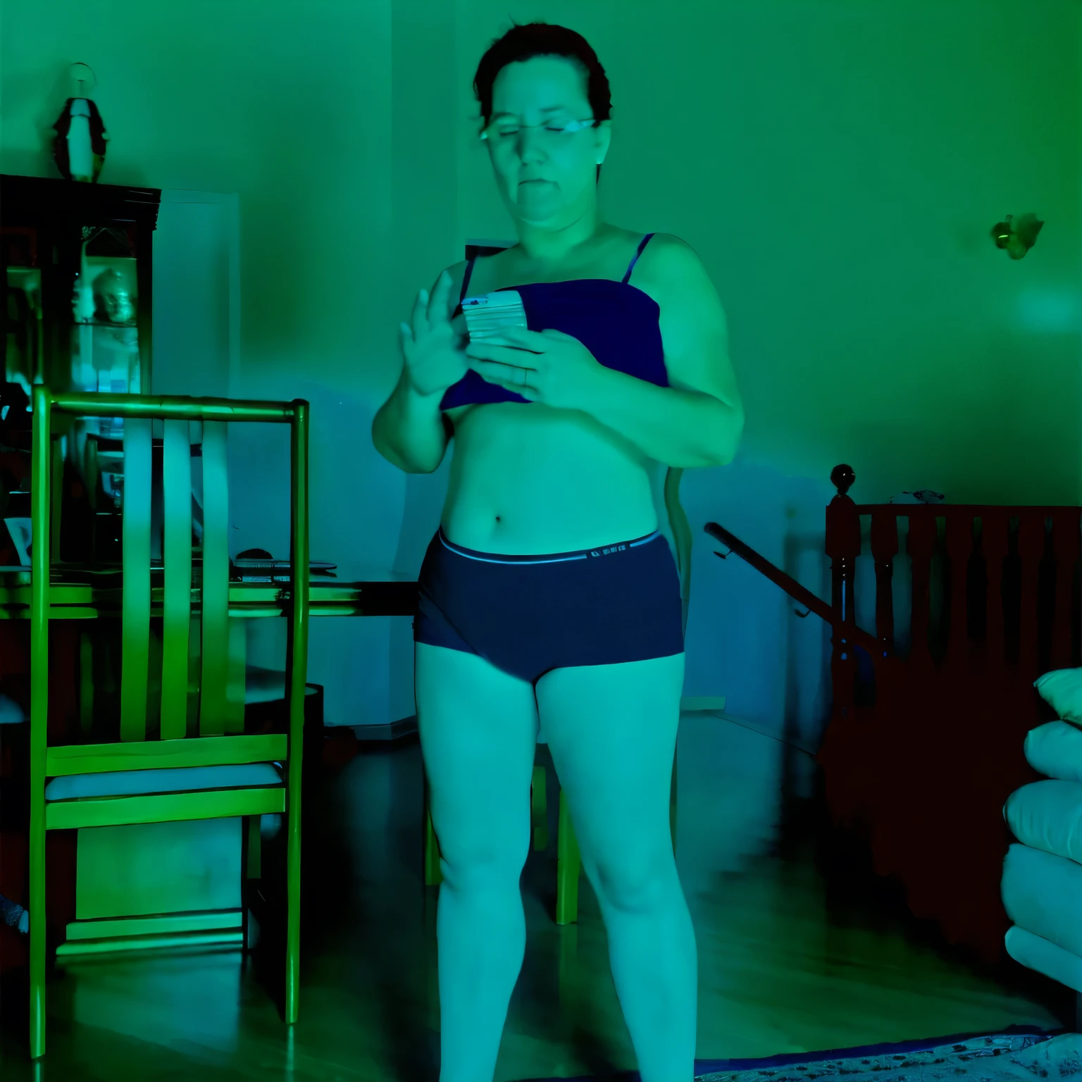 there is a woman in a blue bikini standing in a room, full body profile camera shot, full body in camera, unsettling photo, stable diffusion self portrait, full body photgraph, centered full-body shot, inspired by Nan Goldin, dark photo, obscured underexposed view, eerie self - portrait, distorted pose, photoscan