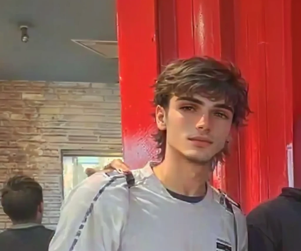 they are two men standing next to each other in front of a red wall, around 1 9 years old, enes dirig, mateus 9 5, very very low quality picture, taken in the early 2020s, aykut aydogdu, mohamed chahin, emad mostaque, by Nándor Katona, carmelo blandino