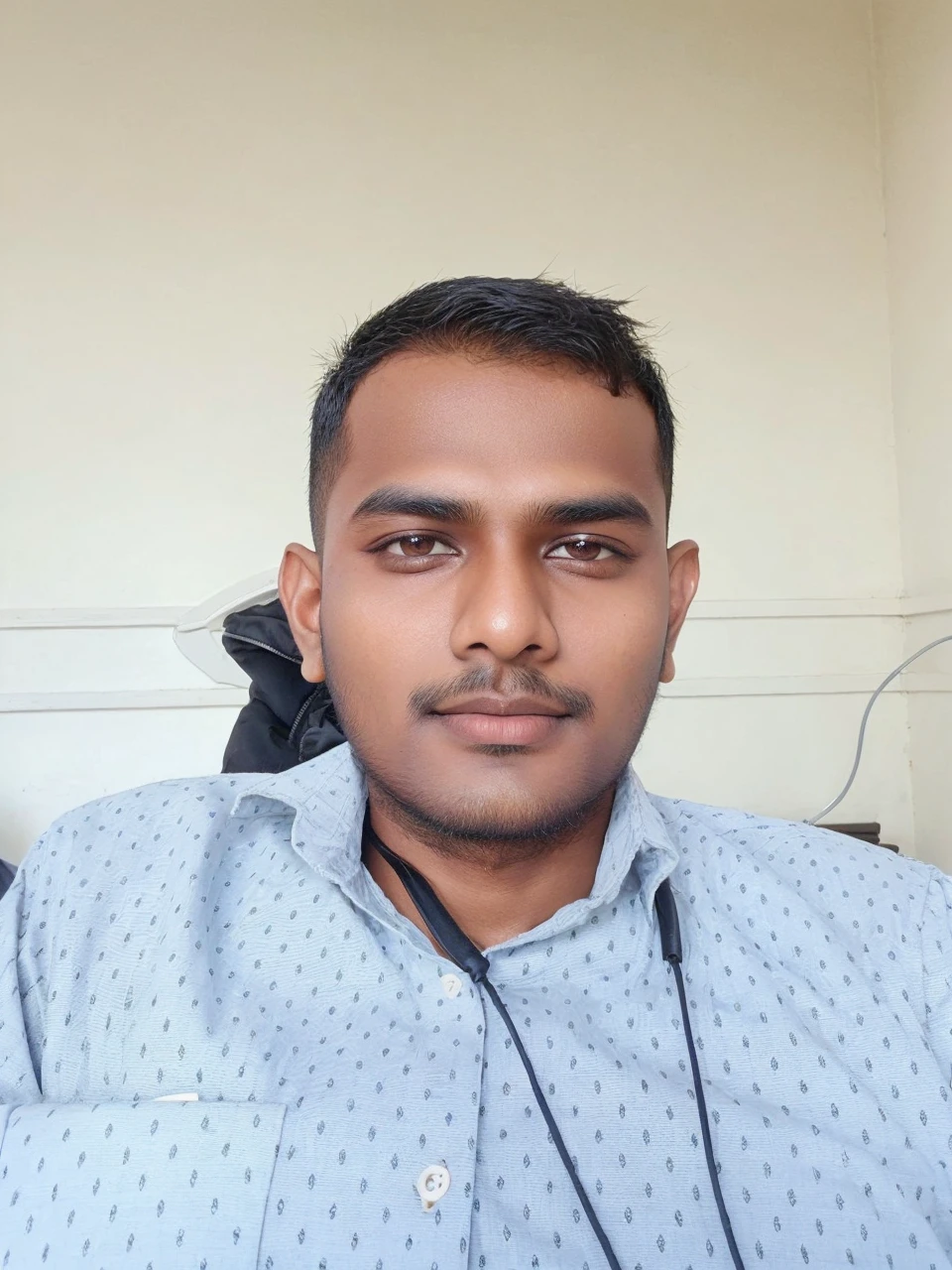 21 years old indian boy with fair skin wearing spectacles and narrow body posing for a linkdin picture in formals with coat 🧥
