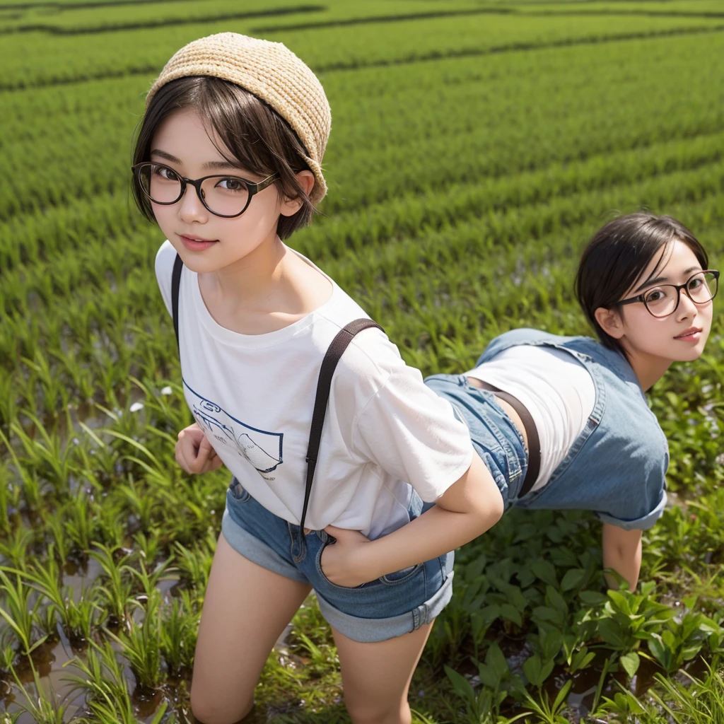 A cute late- with short hair and glasses in the middle of a chubby rice field.
