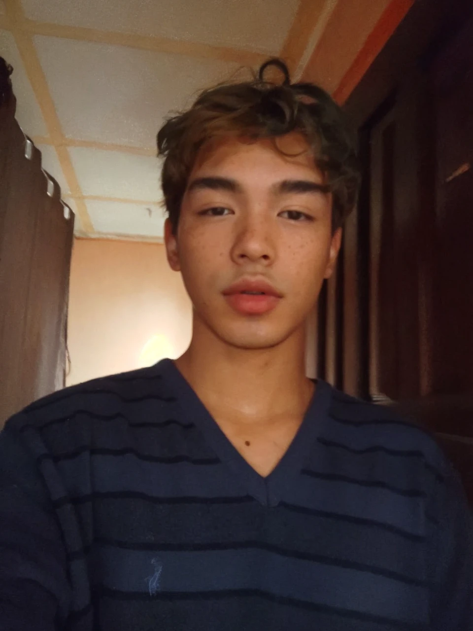 korean face young boy cute with freckles looking to the camera